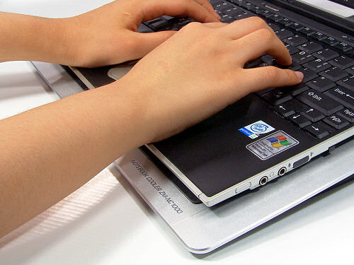 The laptop keyboard is raised for improved ergonomics
