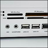 Ports and card reader located behind flap under volume knob