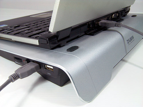 Rear corner view of Zalman ZM-NC1000 showing laptop in place